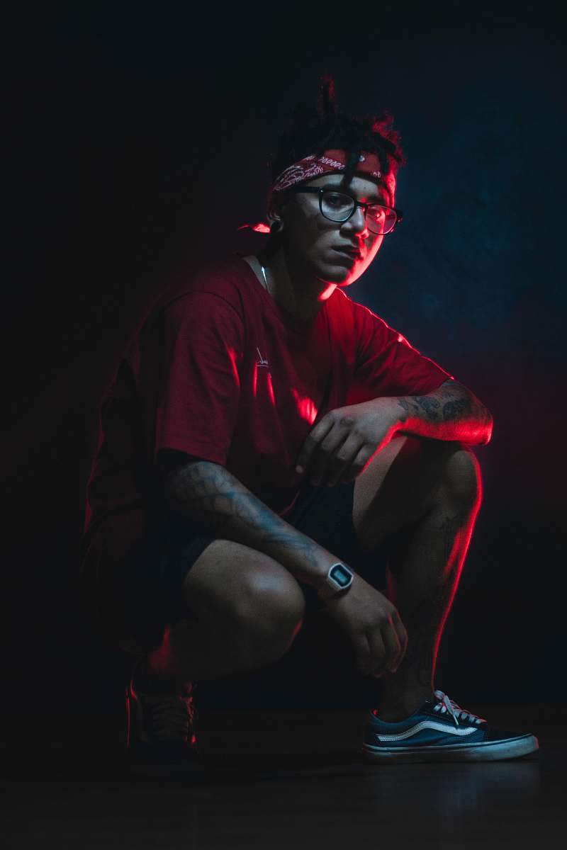 person man wearing red t-shirt and black shorts human