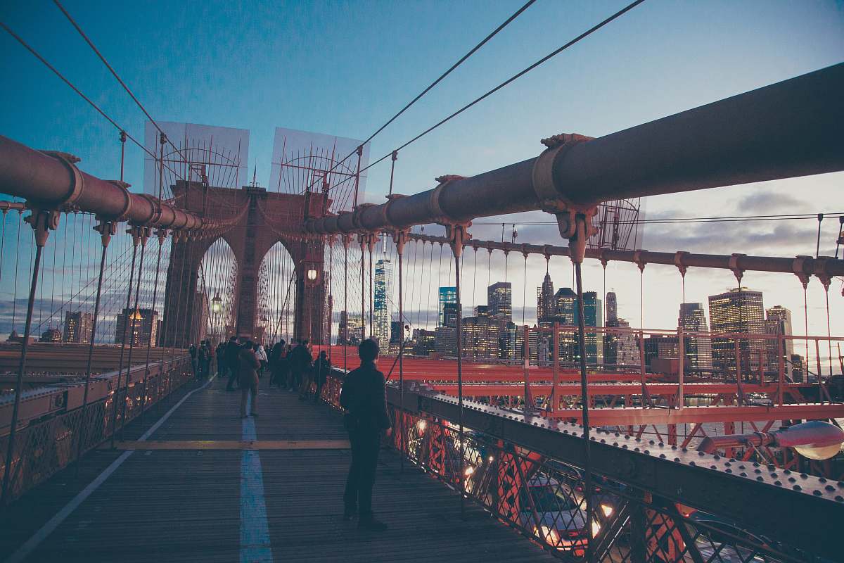person people standing on red bridge during daytime bridge