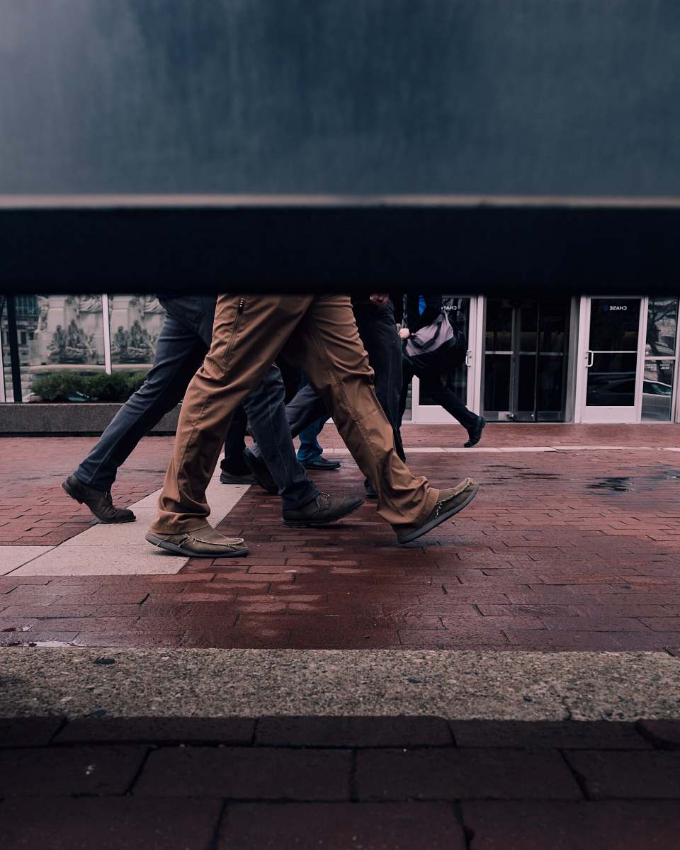 human people walking at the concrete brick person