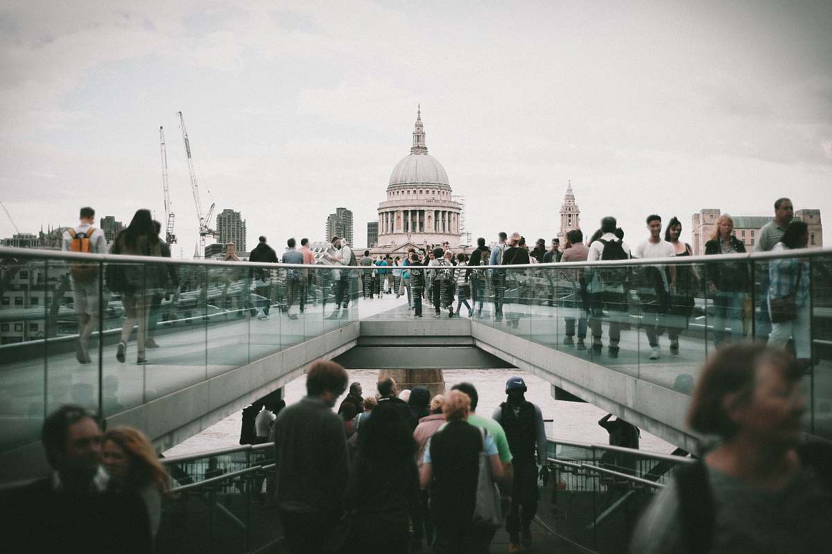 human people walking in front of white concrete dome building during daytime person