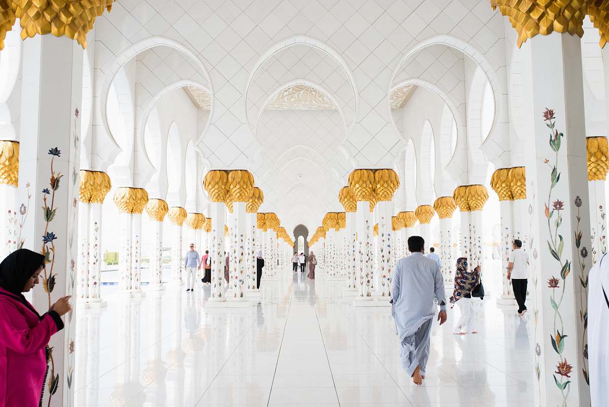 human people walking on pathway inside building person