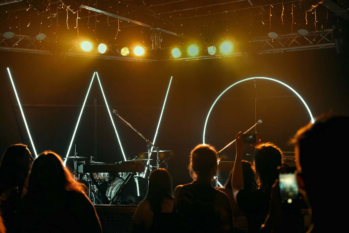 human people watching concert on stage person