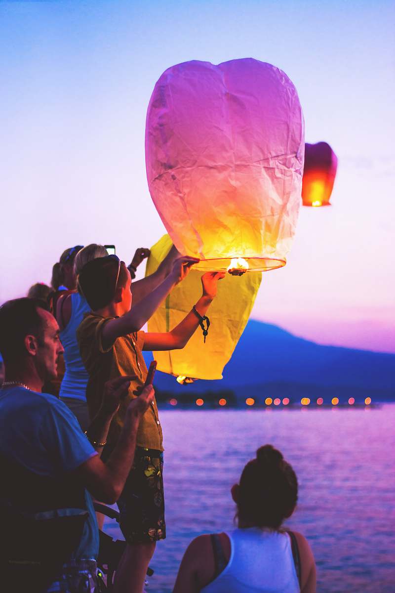 human person holding a lantern person