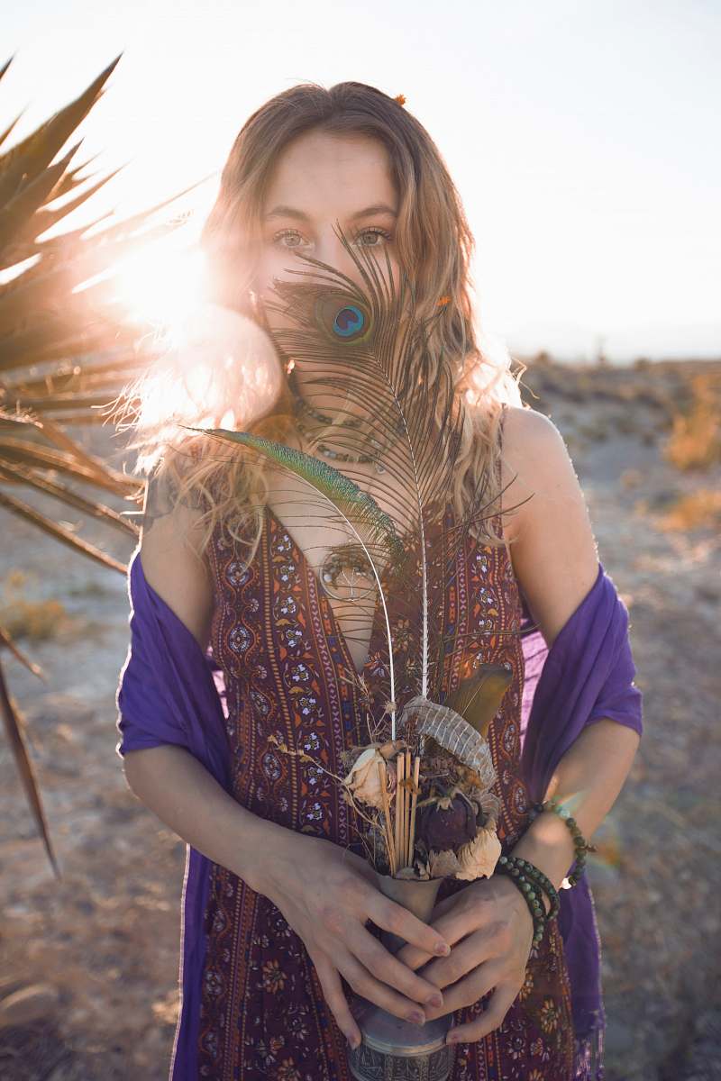 human person holding flower vase person
