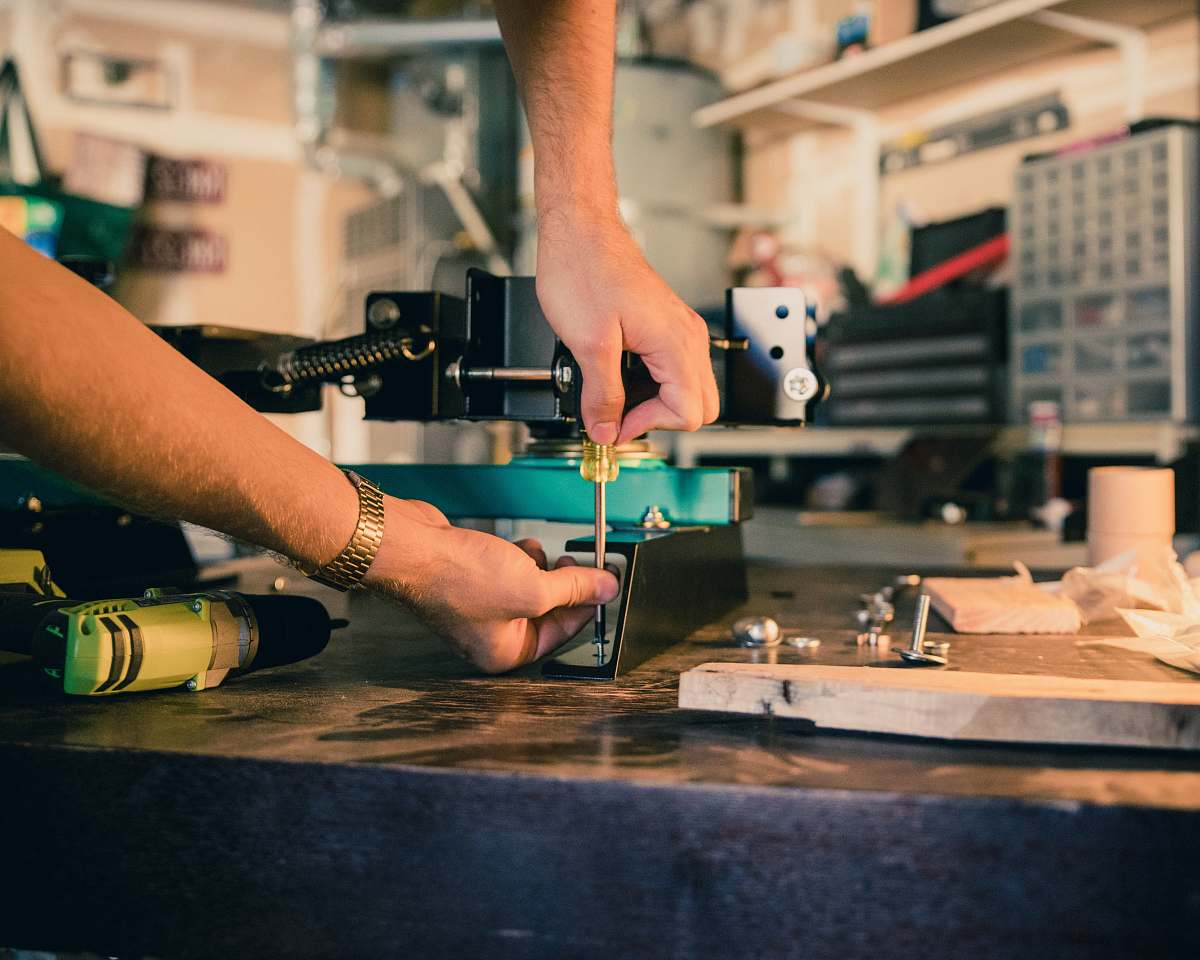 human person holding screwdriver person