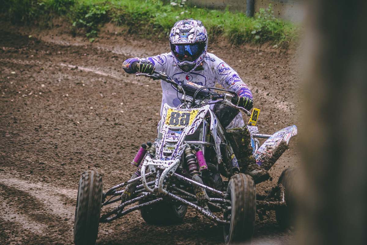 human person pushing gray ATV person