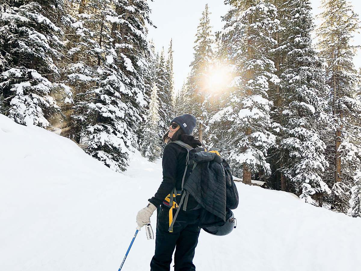 person person standing near snow-covered forest human