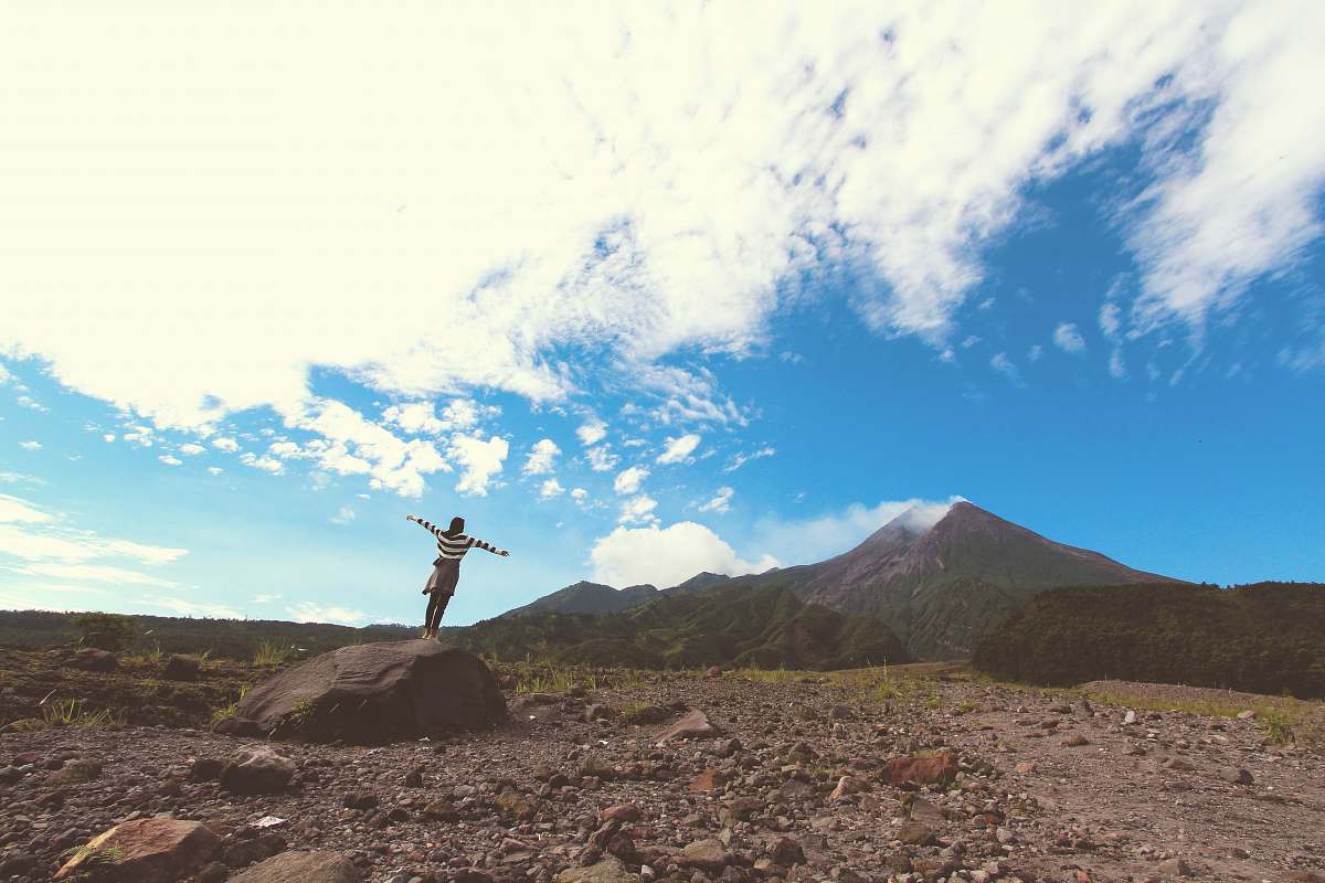 nature person standing on boulder woman