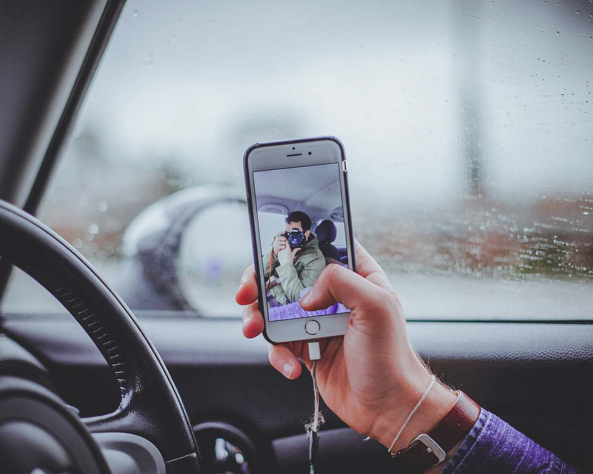 person person taking selfie inside the car human