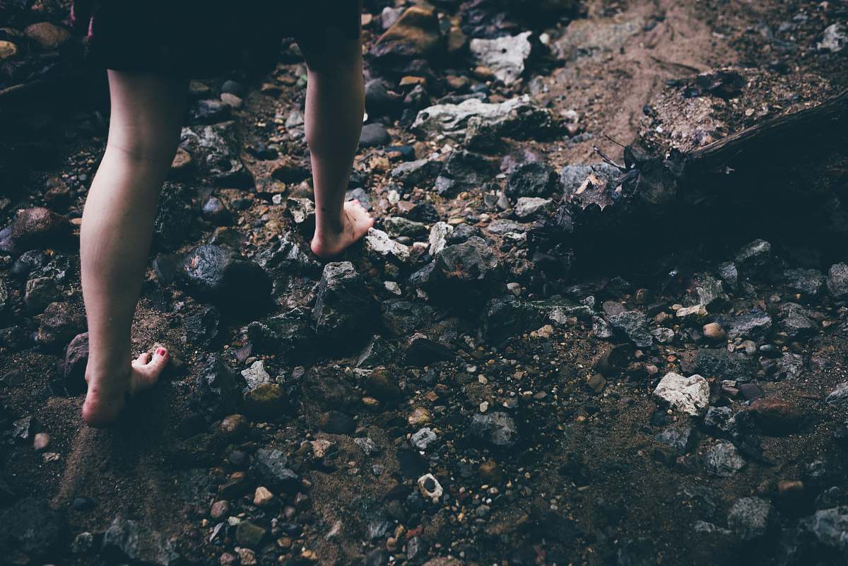 Capture the essence of adventure with this striking image of a human figure traversing rugged rocky grounds. Perfect for outdoor enthusiasts, travel blogs, and websites focused on nature exploration, this photograph beautifully conveys the spirit of adventure and resilience. Ideal for illustrating themes of exploration, hiking, and the great outdoors, it adds a dynamic touch to any project.