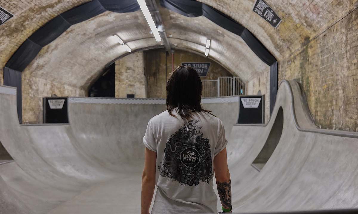 shirt person wearing white top inside tunnel human