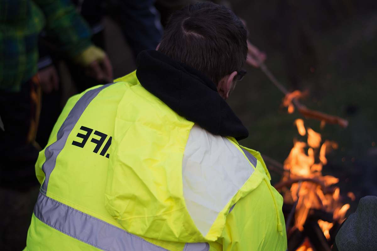 human person wearing yellow and gray high visibility vest person