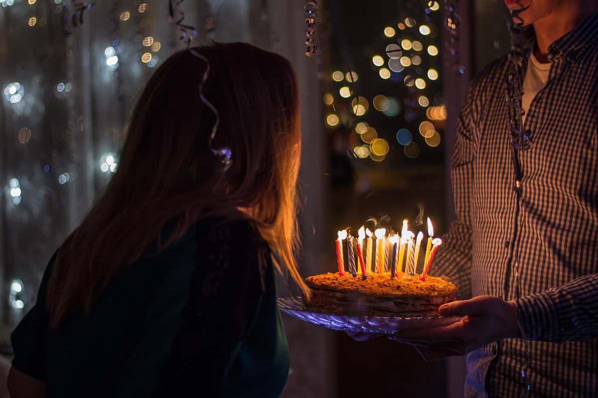 human photo of birthday birth about to blow birthday candles cake