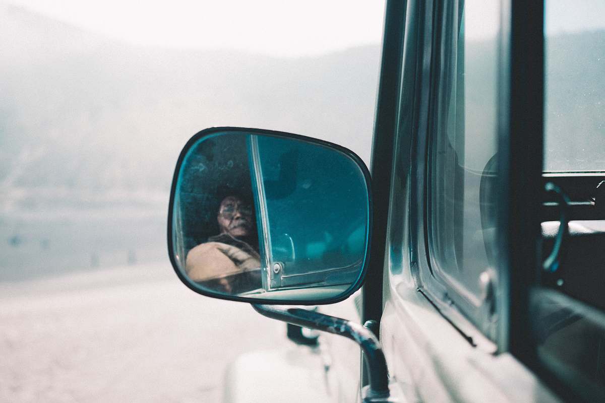 person photo of black vehicle winged mirror mirror