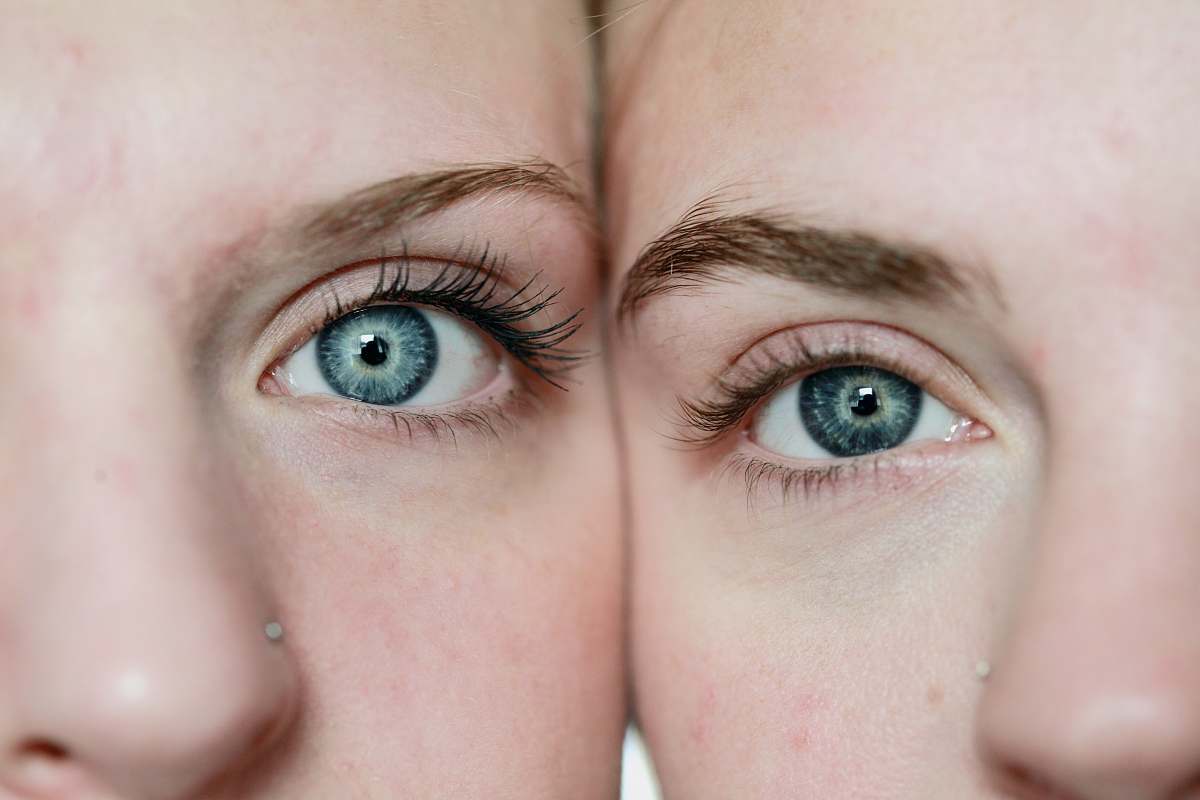 human photo of woman's face reflection person