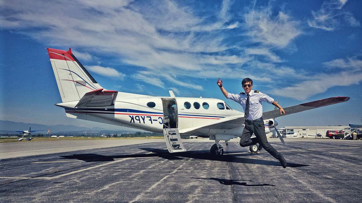 human pilot jumping near aircraft person