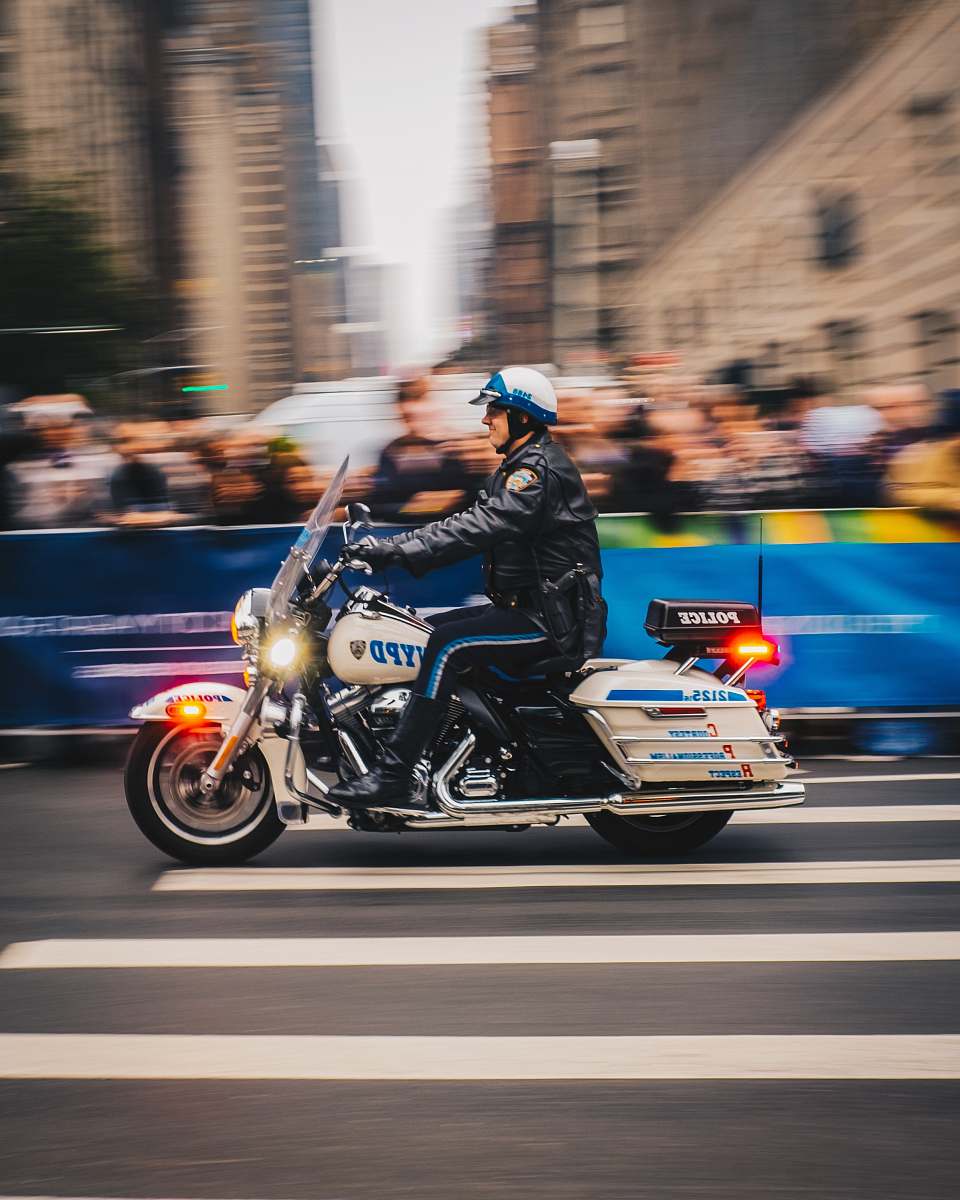 human policeman riding on white motorcycle person