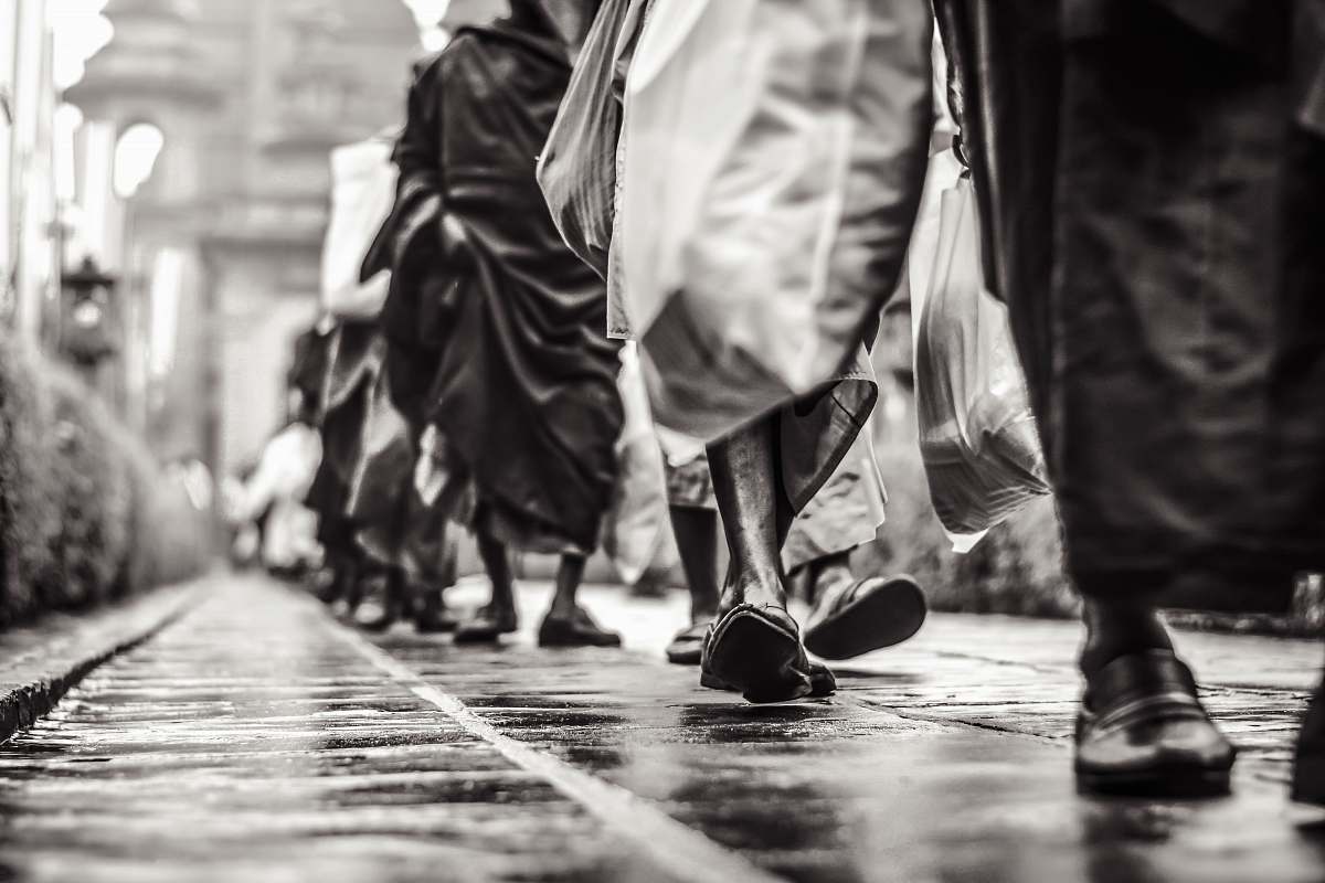 human selective focus graysclae photography of people walking on street person