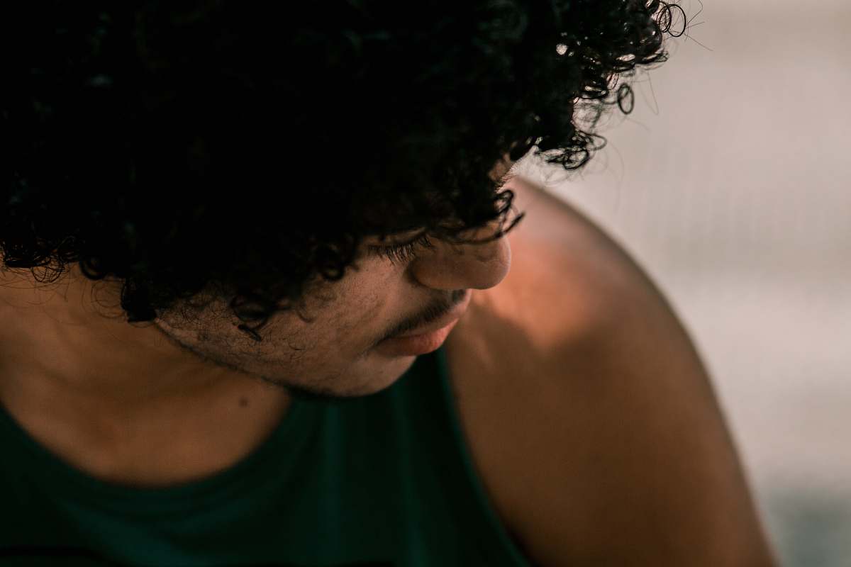 human selective focus of man wearing black tank top person