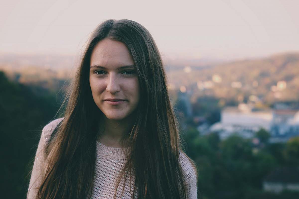 person selective focus photography of woman wearing white crew-neck shirt human