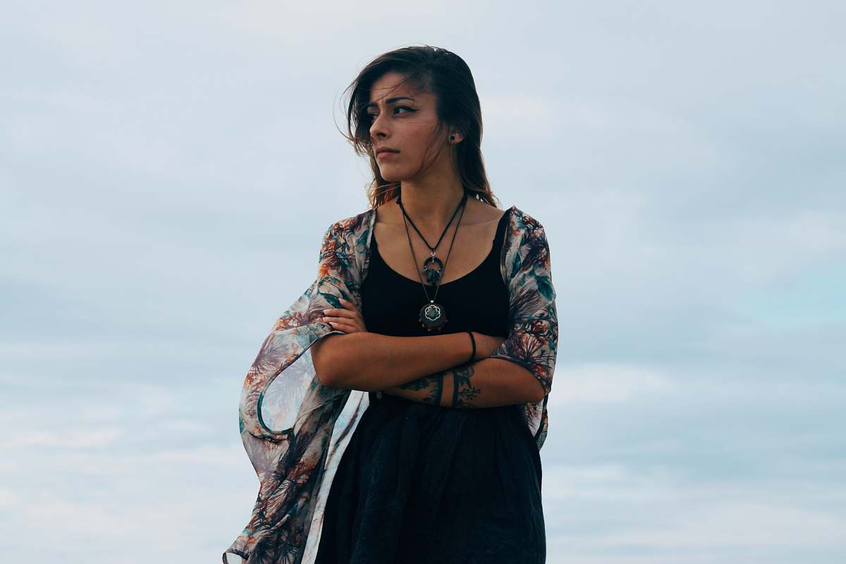 person shallow focus photograph of woman in black dress human