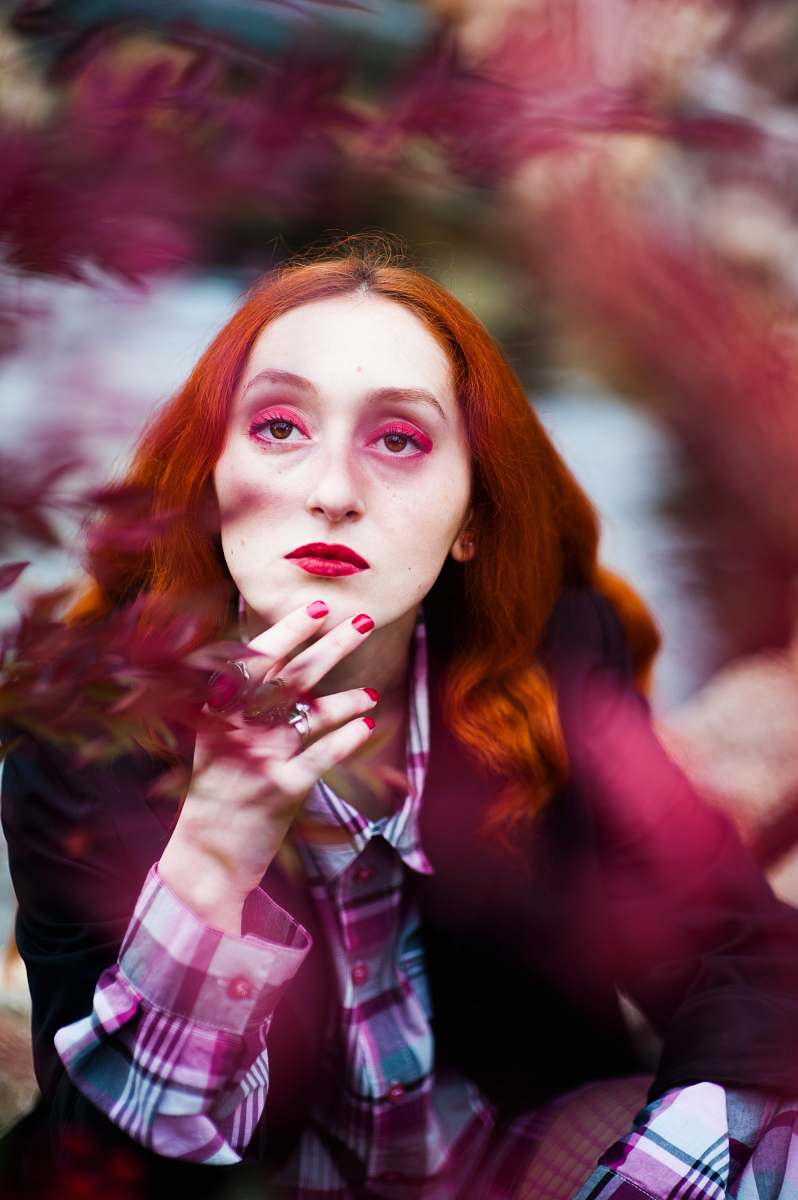person shallow focus photography of woman posing for photo human