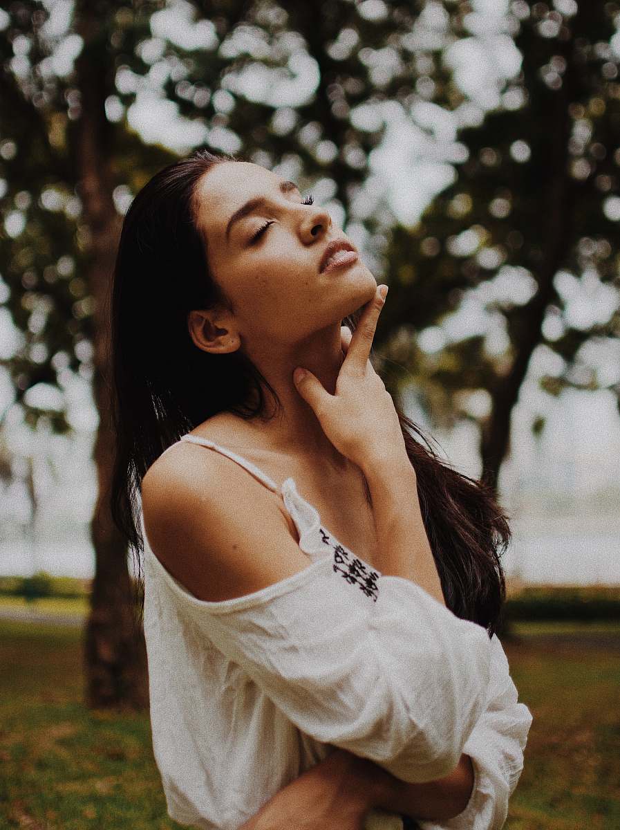 human shallow focus photography on woman in white cold-shoulder top woman