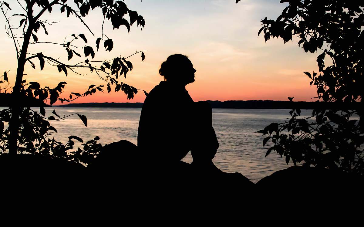 person silhouette of woman near green leafed plants human