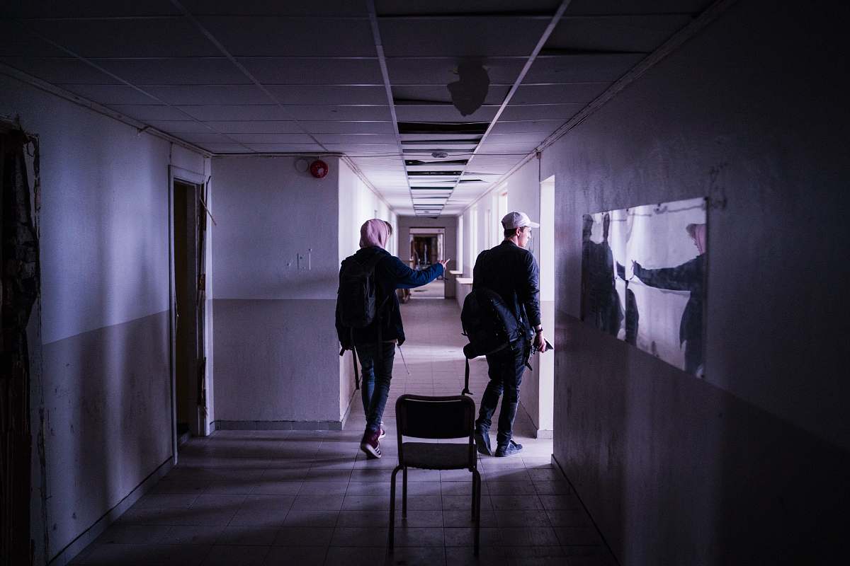 corridor two men walking on corridor chair