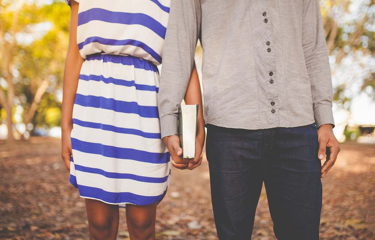 human two people holding book couple