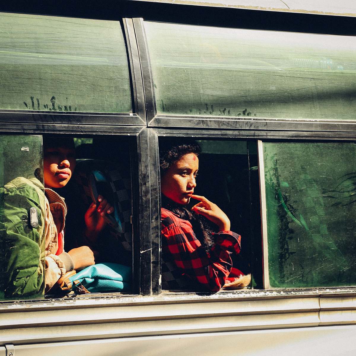 human two people sitting on bus person