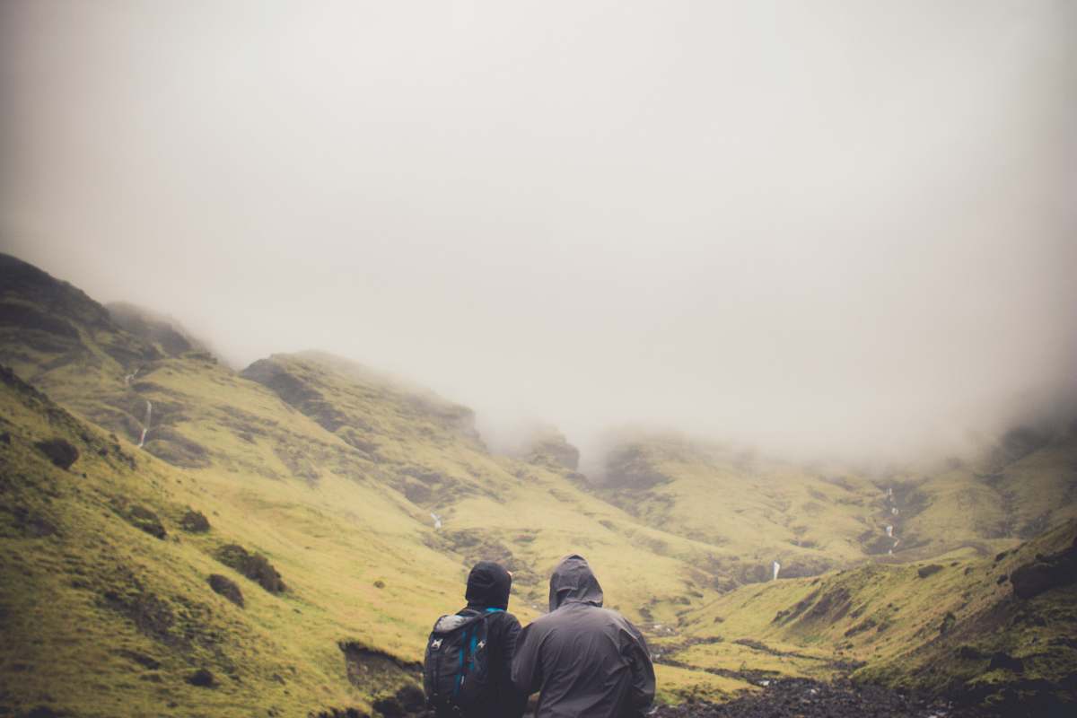 human two people standing looking at mountians person