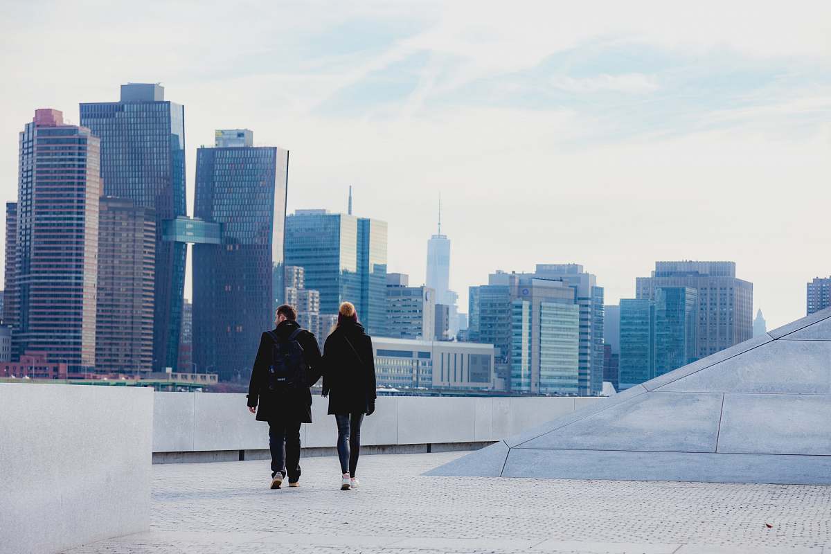 human two people walking on rooftop person