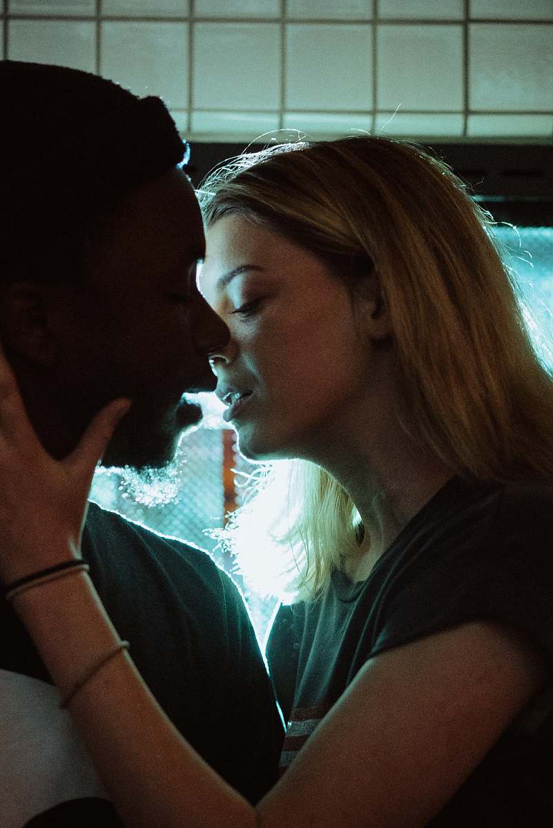 human woman about to kiss man person