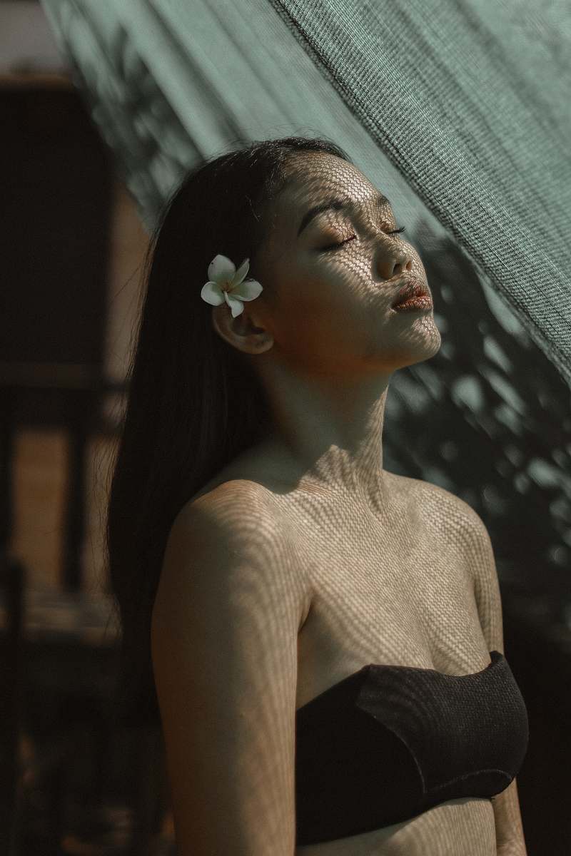 human woman closing eyes person