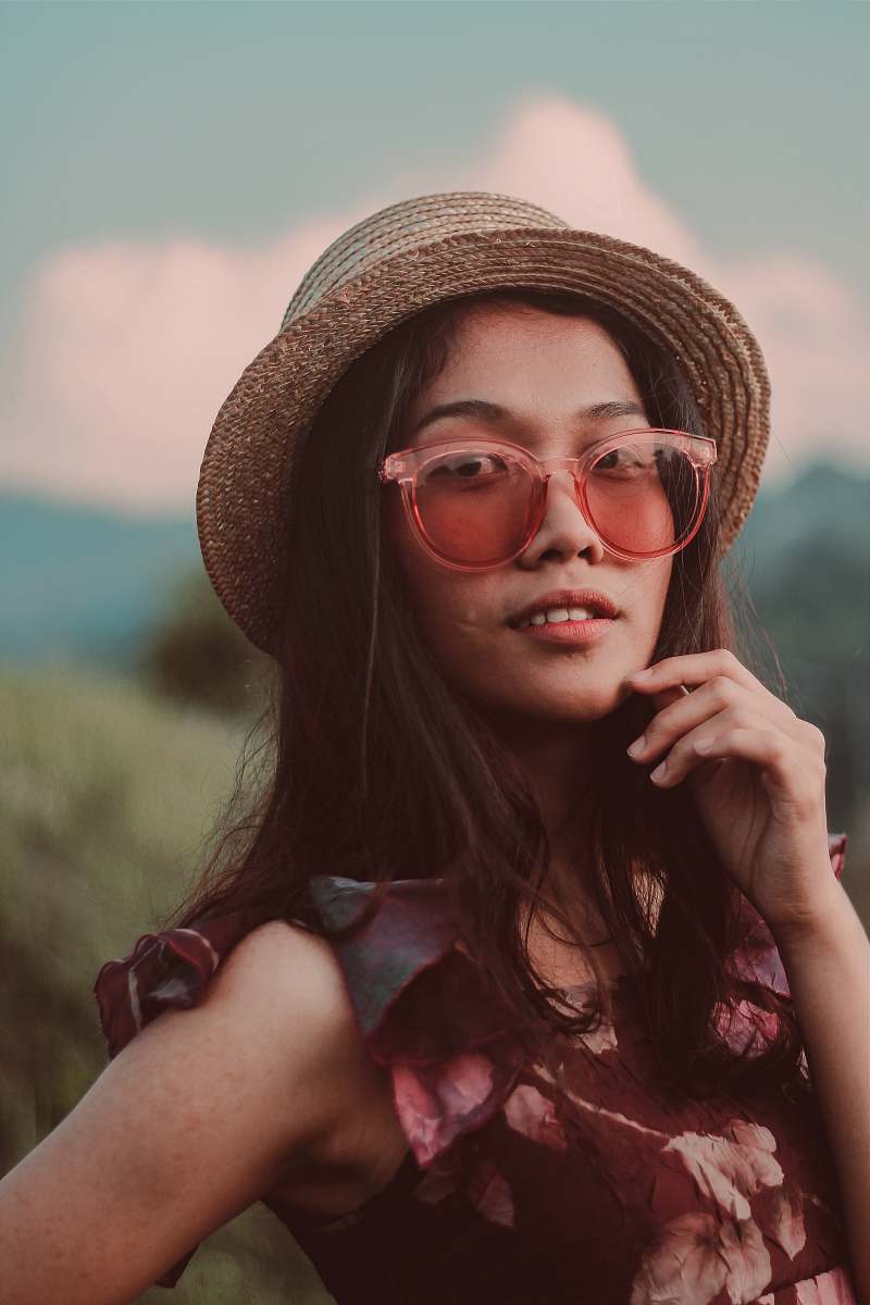 person woman in brown wicker fedora hat posting human