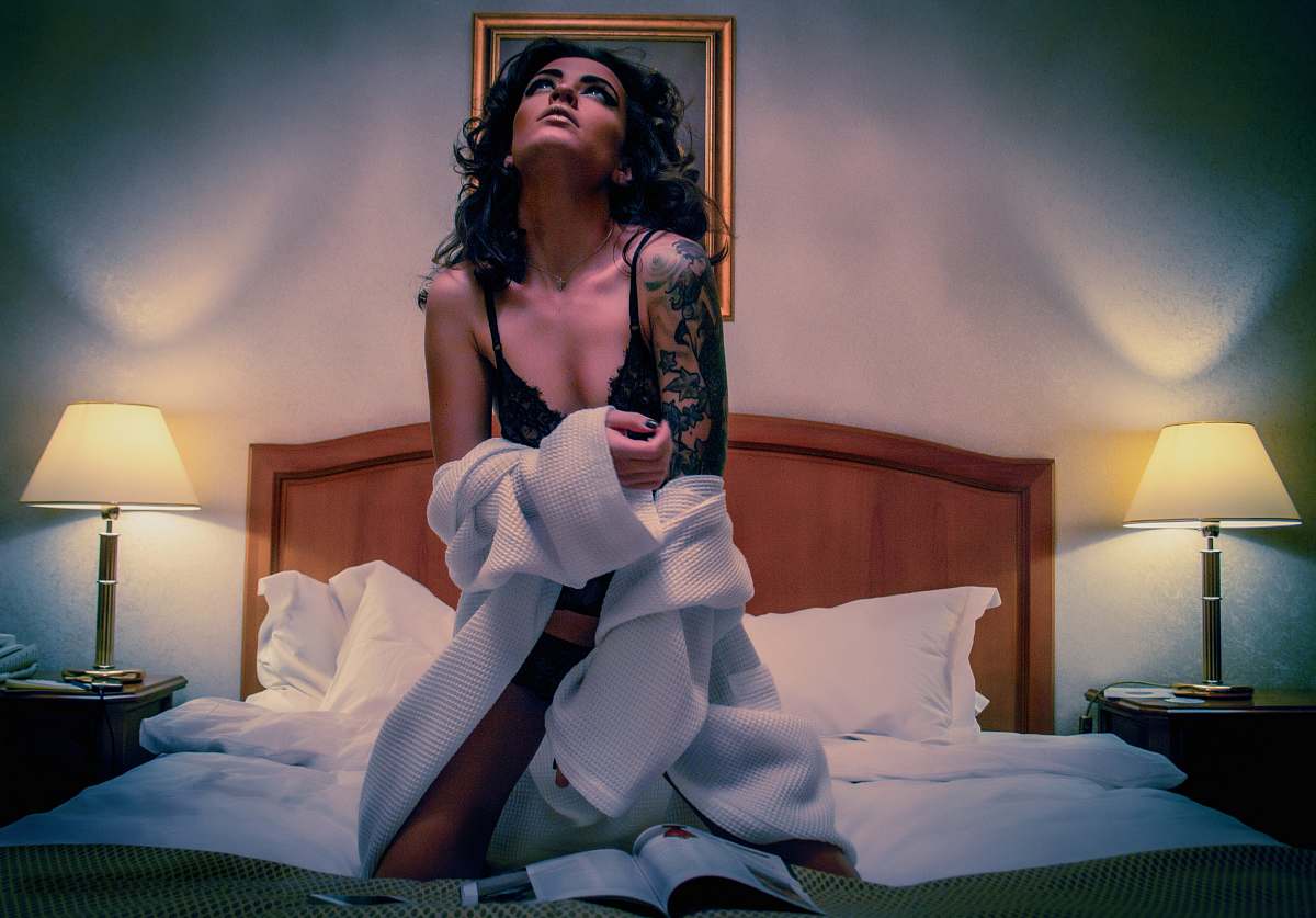 person woman kneeling on white mattress human