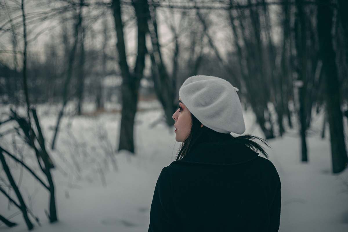 person woman looking to the left standing on snow human