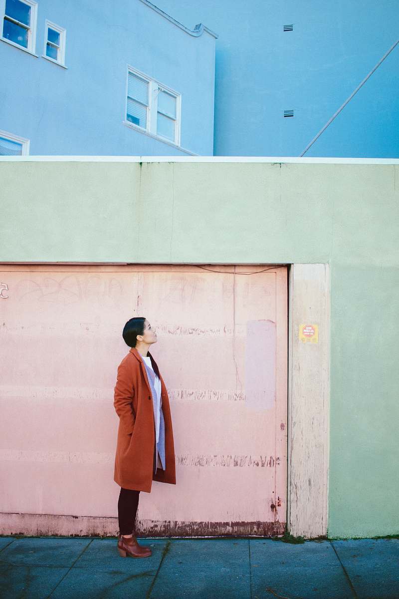 human woman looking up in front of garage door person