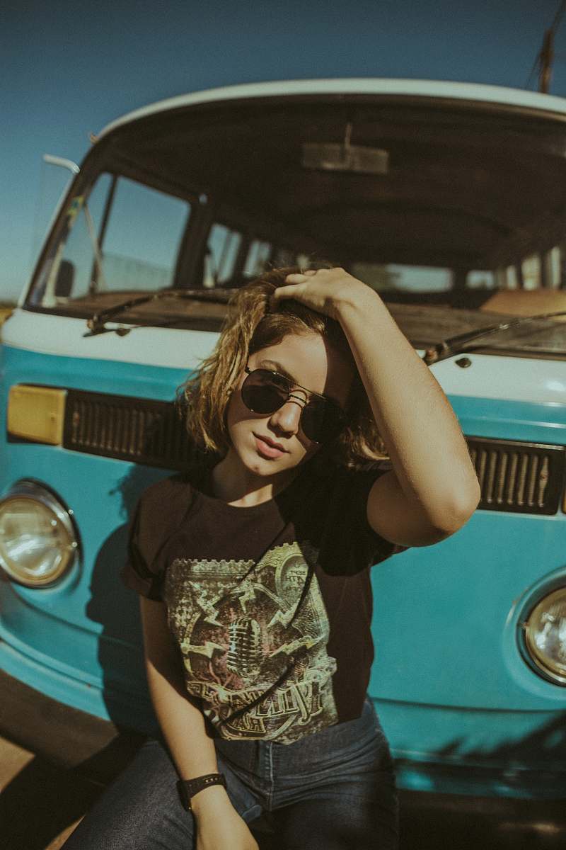 human woman person in front of vehicle person