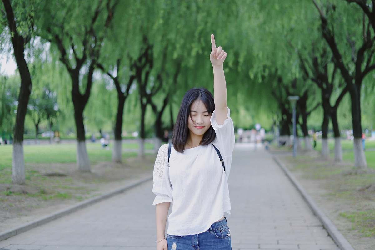 human woman raising her right arm person