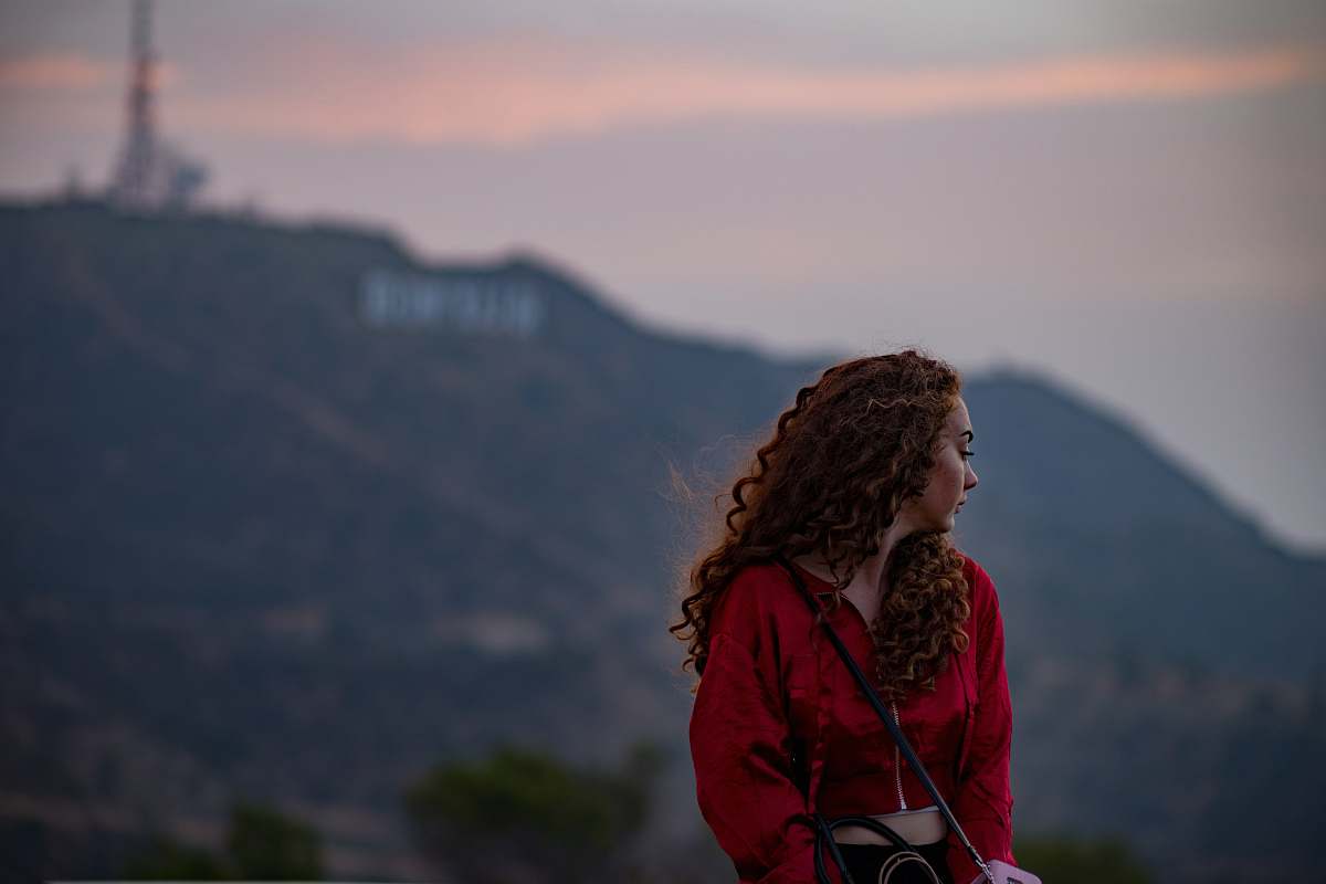 human woman sitting during daytime person