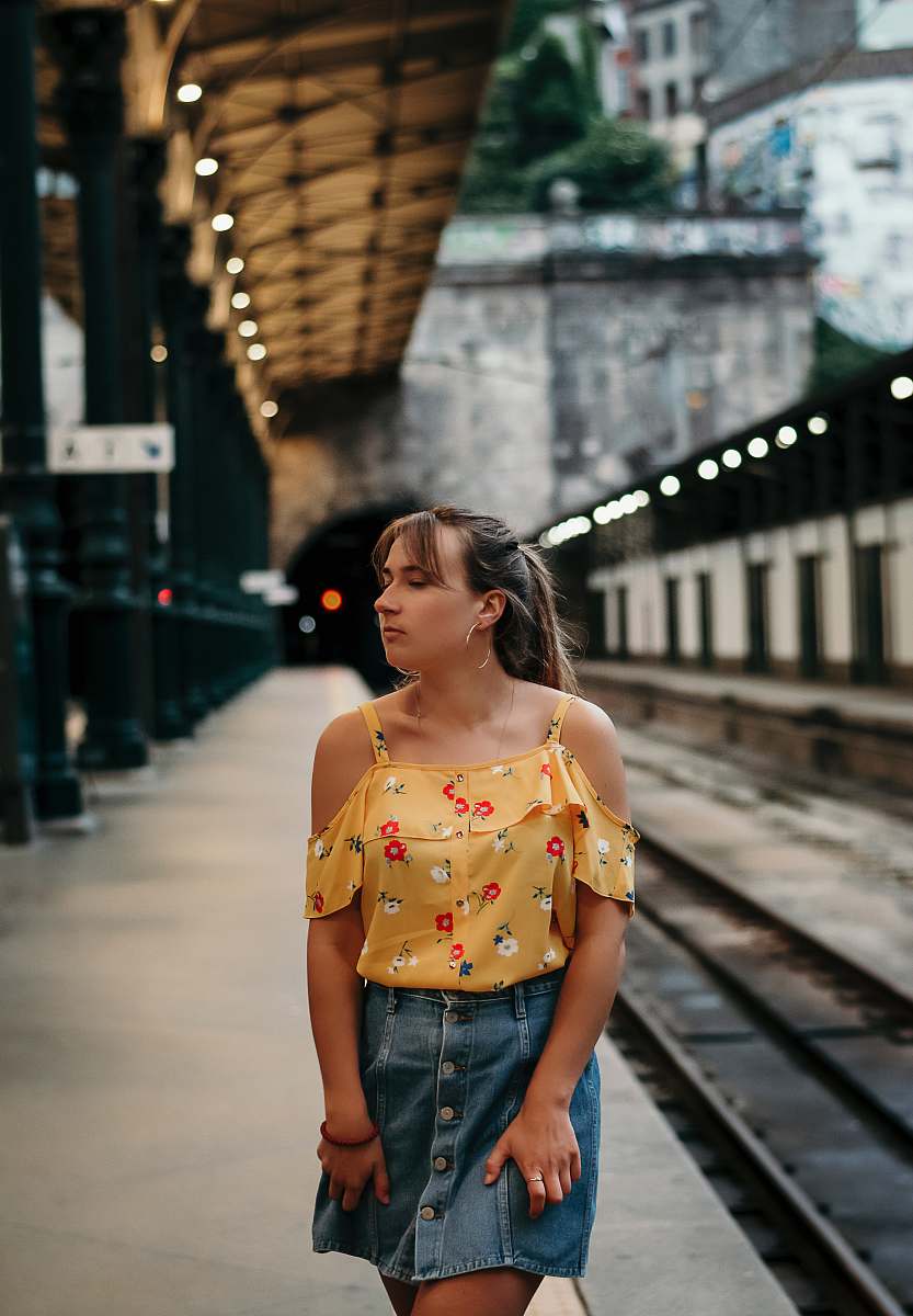 human woman standing in train station person