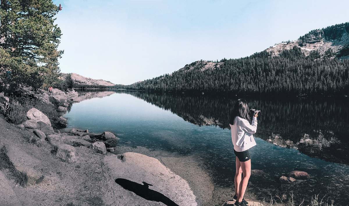 human woman standing near river person