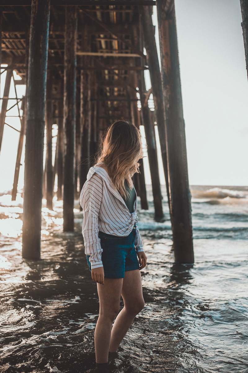 human woman standing on body of water person