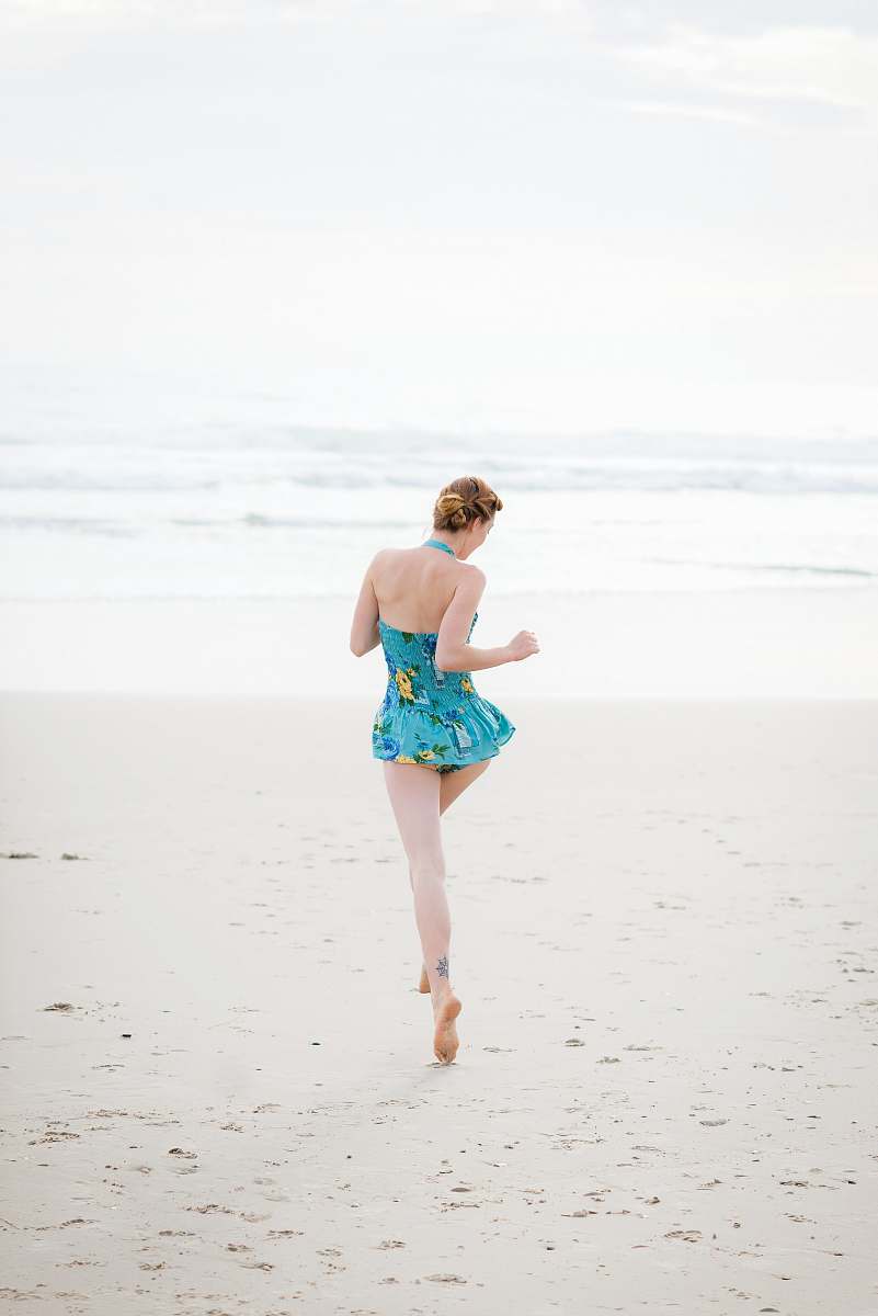 human woman walking on shore near beach beach