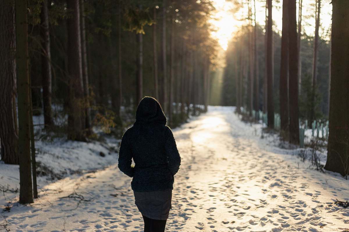 human woman walking on snowfield pathway person