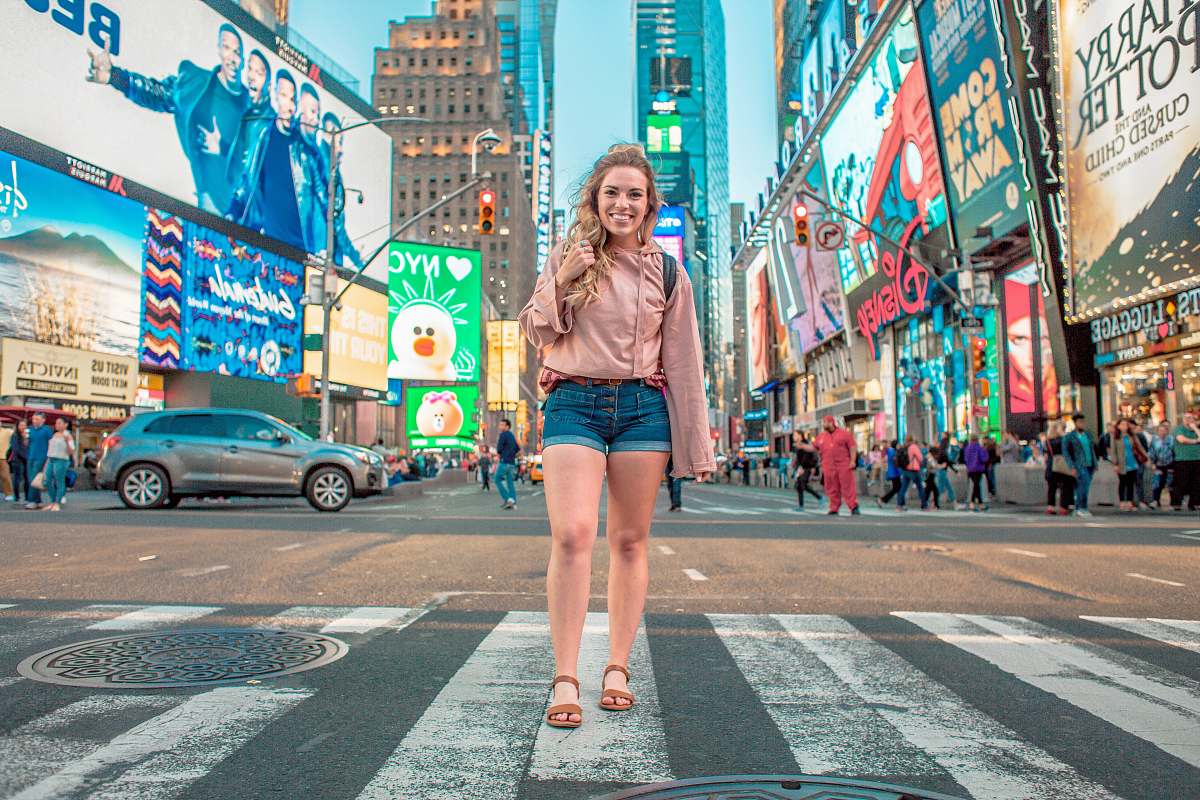 human woman walking on Time Square, New York person