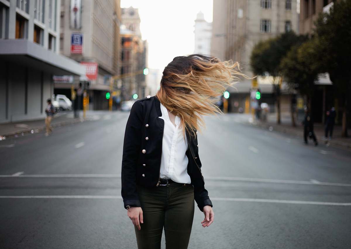 person woman waving hair by the wind on road human