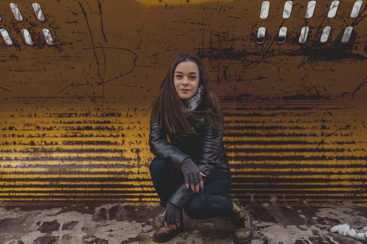 human woman wearing black leather jacket person